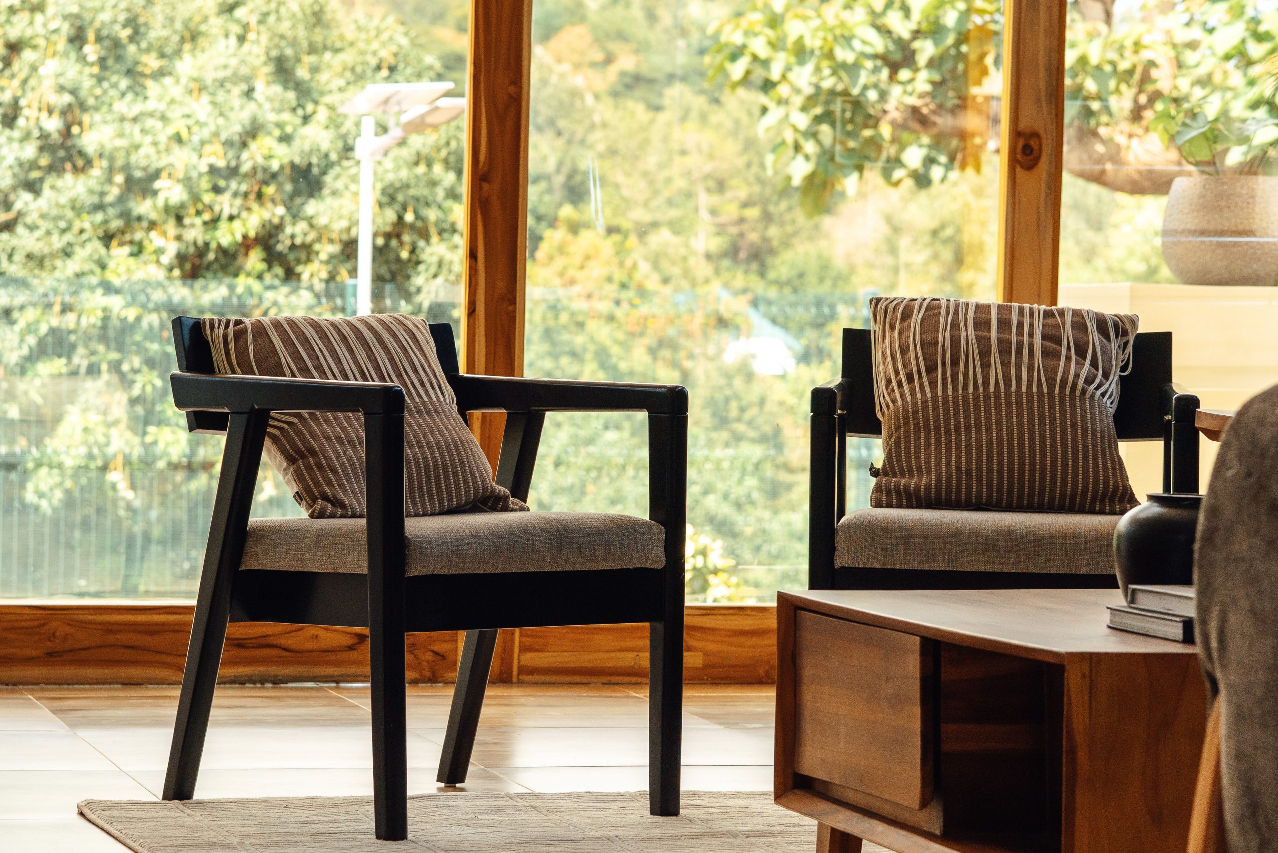 Lounge chairs looking out over greenery at Starico Residence in Arusha